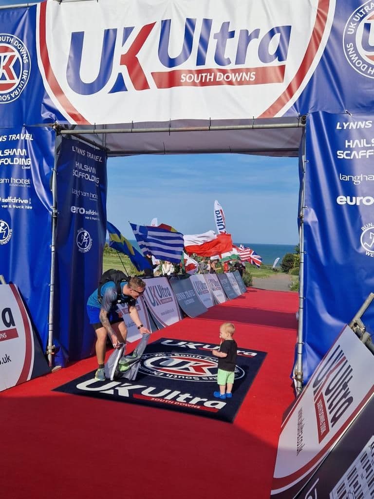 Harry Hatfield at the finish of the UK Ultra South Downs 100-mile race